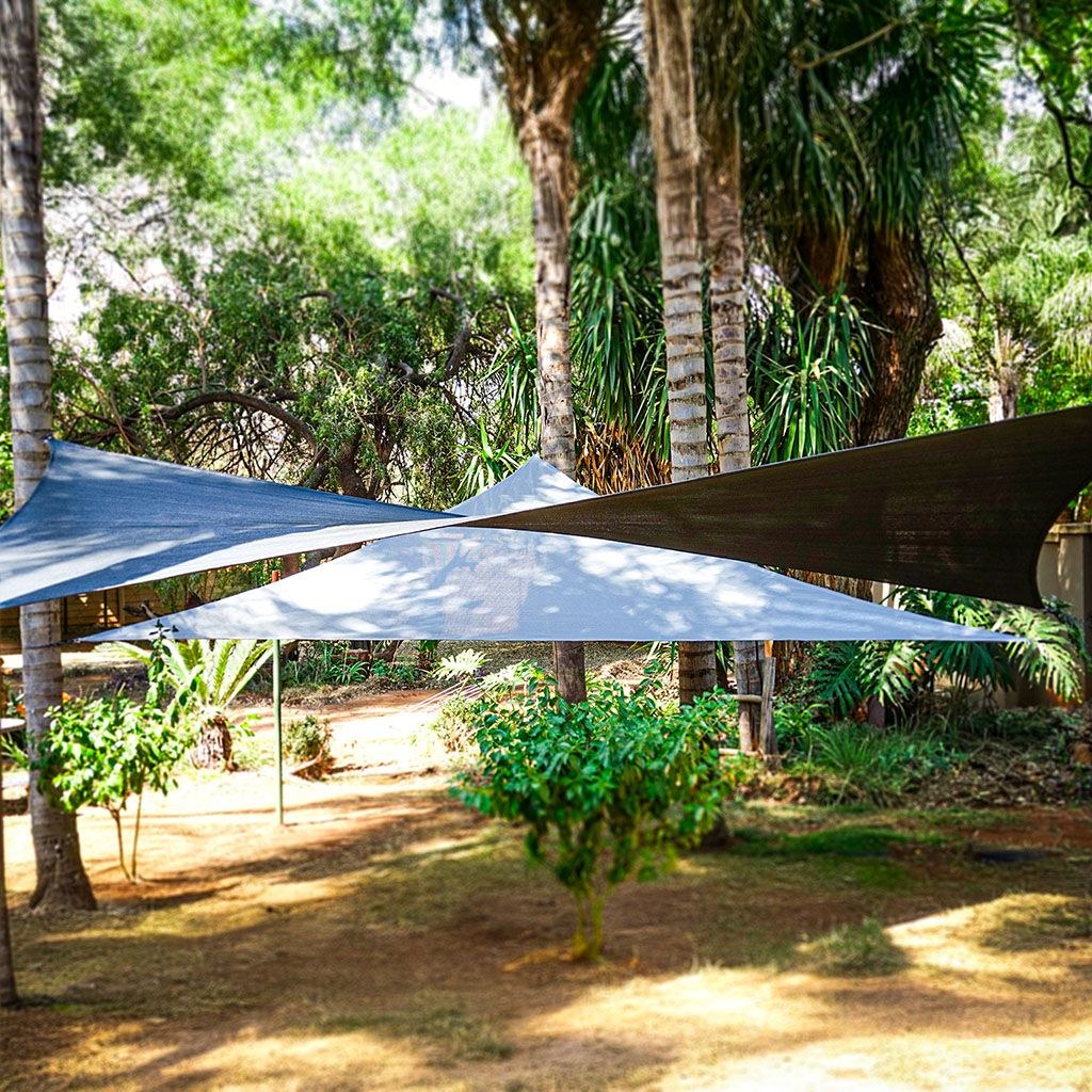 Ilanga shade sails installed between trees in a garden